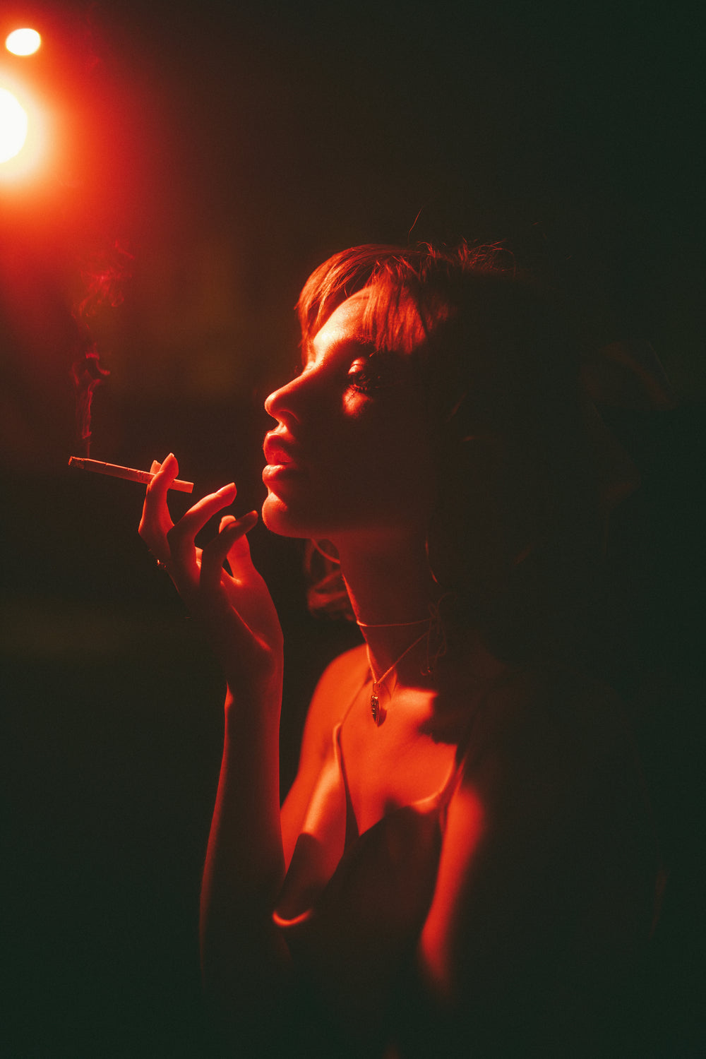 Creator photography lit with THE LIGHTER PRO 5000K with red gel filters